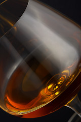 Image showing Glass of brandy over black background