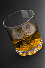 Image showing glass of whiskey and ice