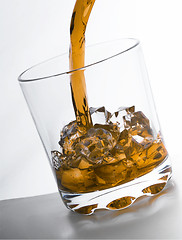 Image showing glass of whiskey and ice