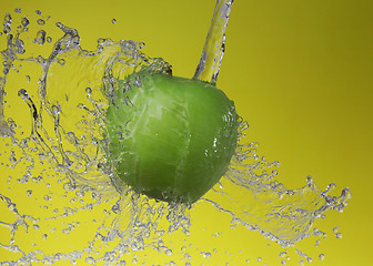 Image showing Green apple on yellow background