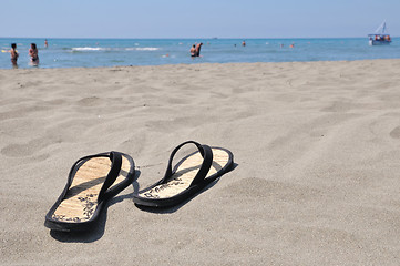Image showing Slippers on beach