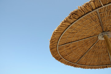 Image showing straw parasol