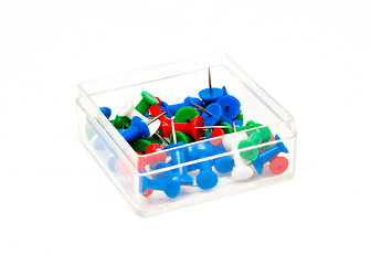 Image showing colorful plastic push pins in a box isolated on white