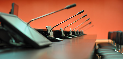 Image showing Conference table, microphones and office chairs close-up