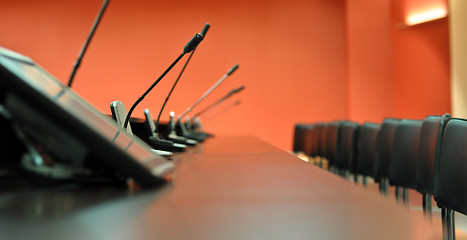 Image showing Conference table, microphones and office chairs close-up