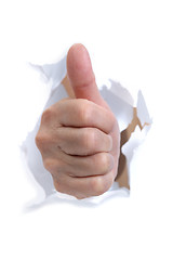 Image showing hand break through the paper with the thumb up 