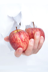 Image showing Hand with an apple