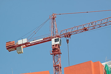 Image showing Construction crane at the construction site, on a cloudless sky 