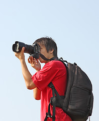 Image showing asian man taking photo 