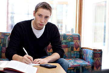 Image showing Male College Student Doing His Homework