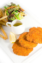 Image showing classic Milanese veal cutlets and vegetables