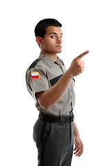 Image showing Security officer or warden pointing finger