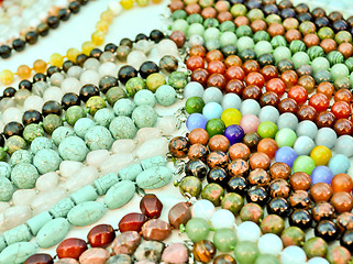 Image showing lots of colorful glass beads  