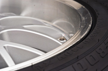 Image showing low-profile car wheel on a black background close up