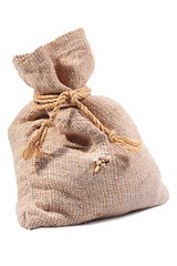 Image showing Wheat falling from a hole in the bag