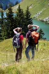 Image showing Young people hiking in the mountains