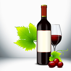 Image showing Red wine glass and bottle