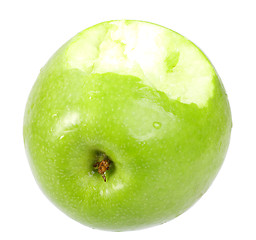 Image showing Single a green apple with bite