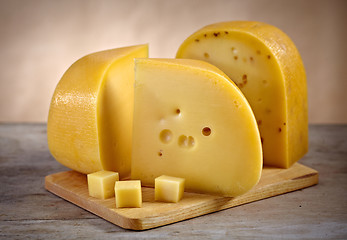 Image showing cheese on wooden cutting board