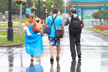 Image showing three in the rain