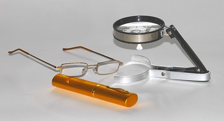 Image showing magnifying glasses with cases for glasses