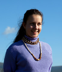 Image showing Beautiful girl in a necklace laughs