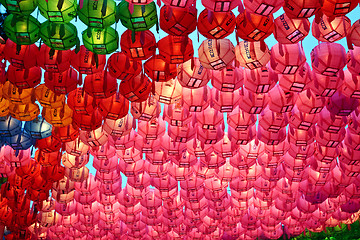 Image showing Red and pink  paper lanterns in buddhist temple