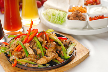 Image showing original fajita sizzling hot  on iron plate