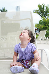 Image showing Cute happy one year old baby looking up in a relax place