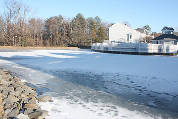 Image showing Frozen river in countryside during winter time 