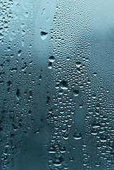 Image showing natural water drops on glass