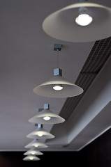 Image showing several modern chandeliers on the ceiling in the bar