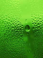 Image showing water drops on green glass
