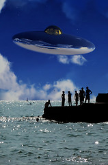 Image showing UFO Over The Coast With People In Foreground