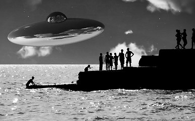 Image showing UFO Over The Coast With People In Foreground