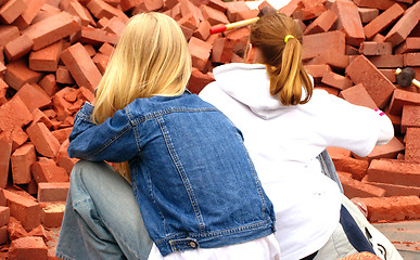 Image showing Teen girls Vs.bricks