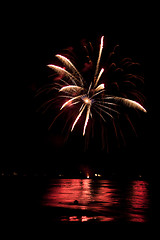 Image showing Fireworks Over Water with Reflections