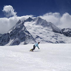 Image showing Snowboarder in high mountains