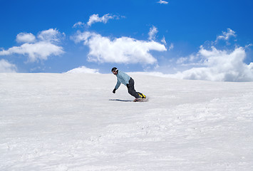 Image showing Snowboarder against blue sky