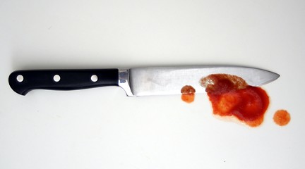 Image showing knife with red blood from murder