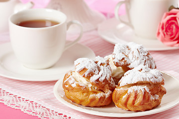 Image showing eclairs and tea