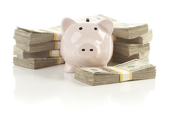 Image showing Pink Piggy Bank with Stacks of Money