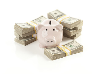 Image showing Pink Piggy Bank with Stacks of Money