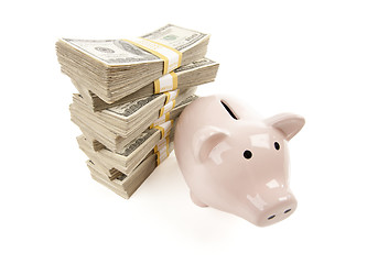 Image showing Pink Piggy Bank with Stacks of Money