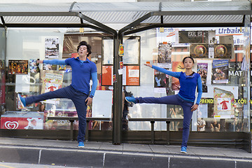 Image showing Dancers in a bus selter