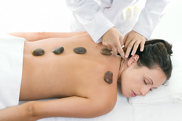 Image showing Female receiving a relaxing massage treatment