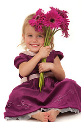 Image showing Little Girl and Flowers