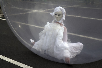 Image showing Masked woman in a sphere