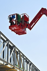 Image showing red hydraulic construction cradle 