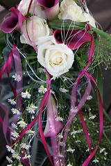 Image showing White roses and purple Callas decorated with beautiful grinding